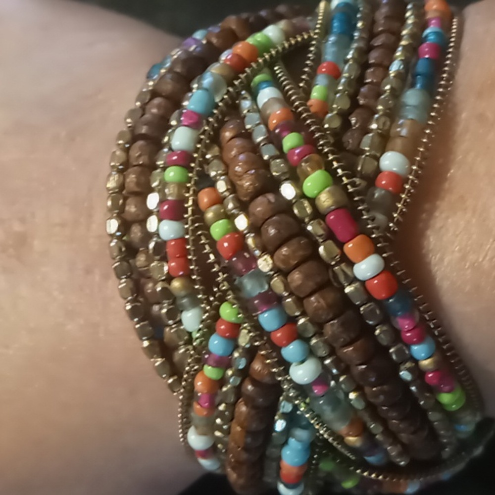 Multi color memory wire wrap bracelet braided with wooden beads gold tones
